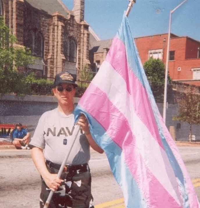 Monica Helms holding the Transgender Pride Flag.